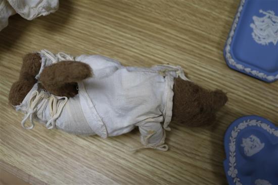 An early 20th century Bisque jointed doll with open mouth and sleeping eyes, and two small plush animals